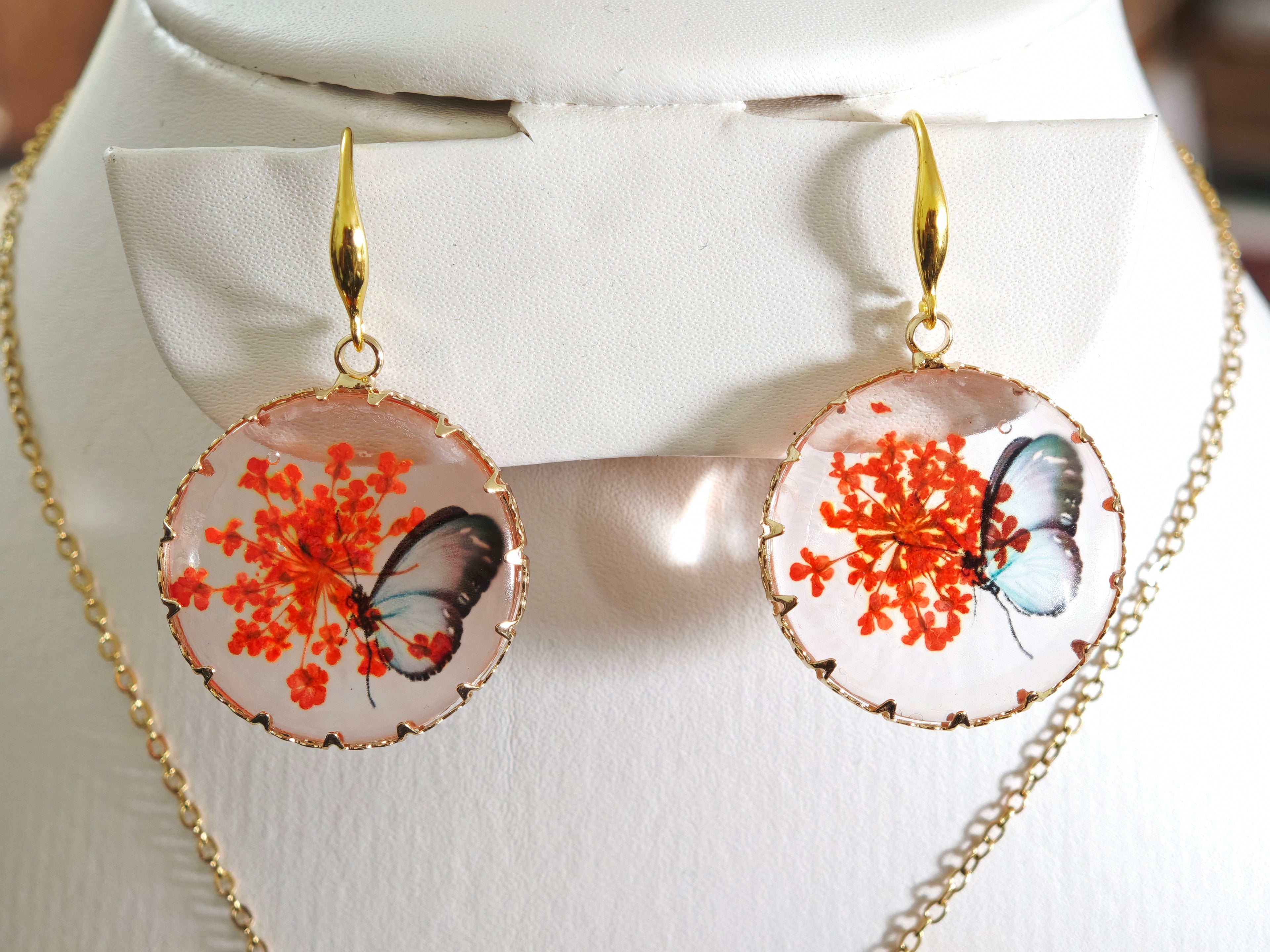 Sapraa Trends Unique Round Resin Earrings in Gold Mould with real flowers preserved in orange and White