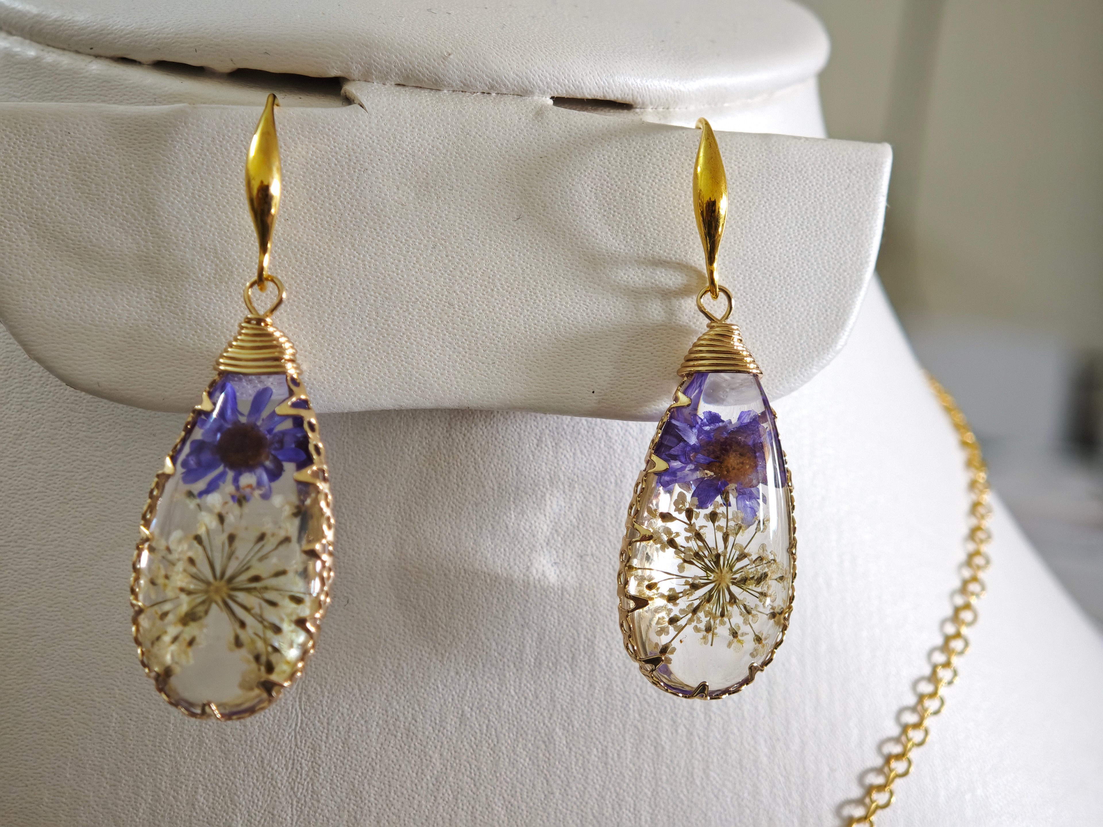 Sapraa Trends Unique Drop Resin Earrings in Gold Mould with real flowers preserved in white and purple