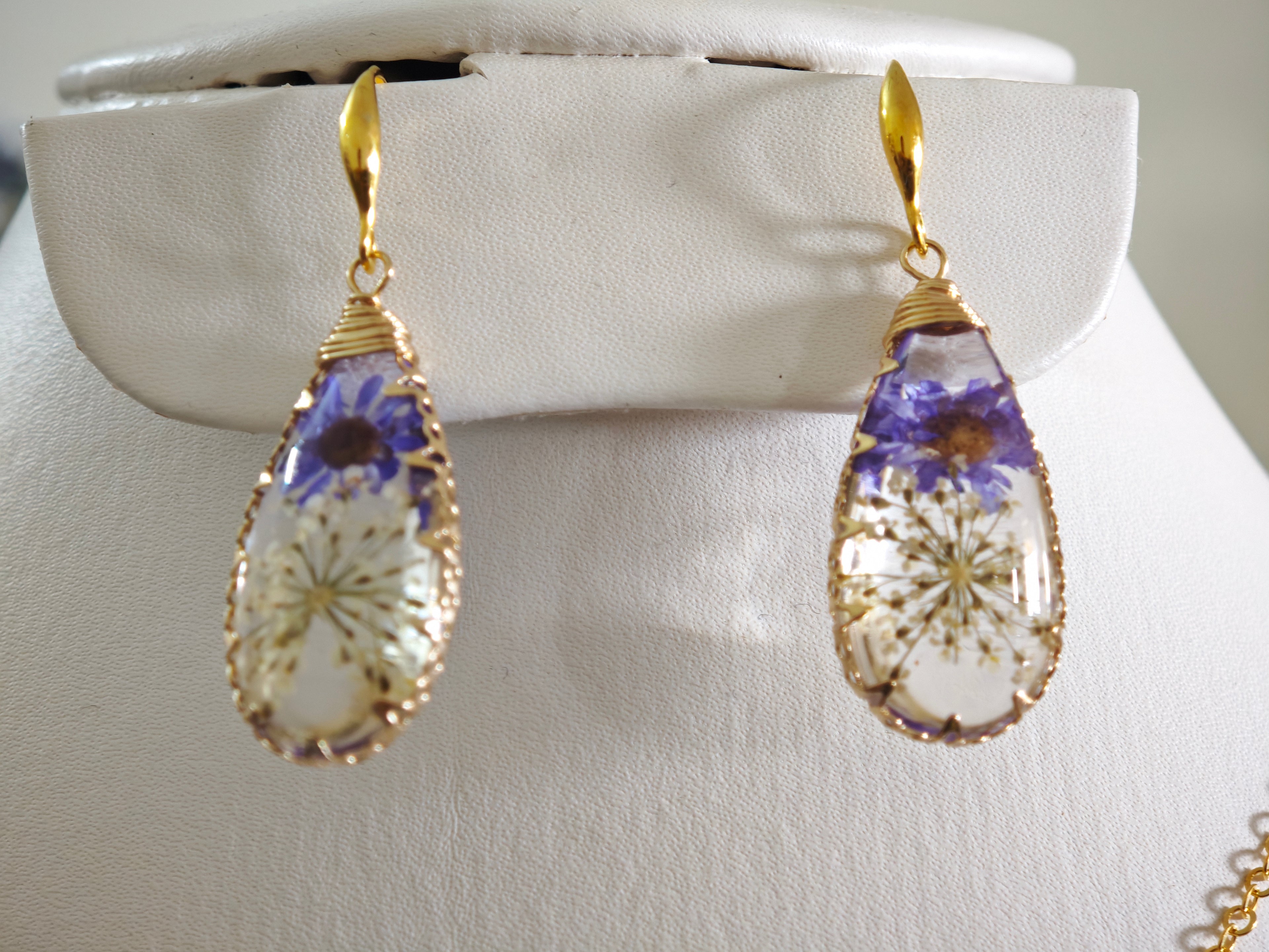Sapraa Trends Unique Drop Resin Earrings in Gold Mould with real flowers preserved in white and purple